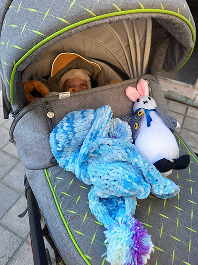 Baby with gifts donated by IDDT members