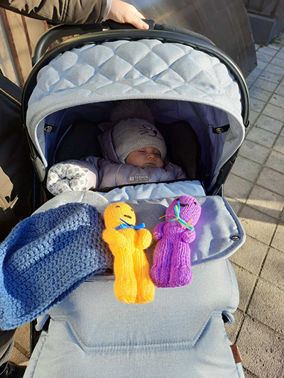 Baby with gifts donated by IDDT members