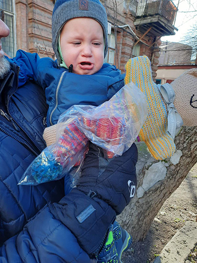 Baby with gifts donated by IDDT members