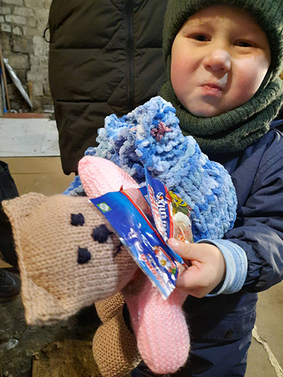 Baby with gifts donated by IDDT members