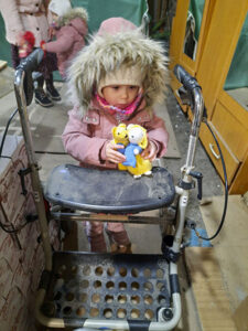 Child with gifts donated by IDDT members